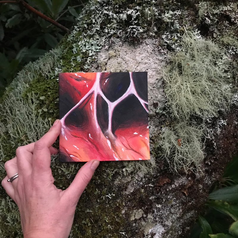 Photograph of 15cm square painting on canvas by Iona May Durbin, entitled "Heartstrings Held",  dated 2022,  the painting  resembles the interior of a heart, and is placed against a tree trunk covered in diverse lichens.
